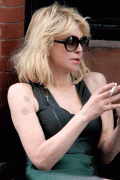 Courtney Love smoking a cigarette while texting in LA 2.6.10 - 7x